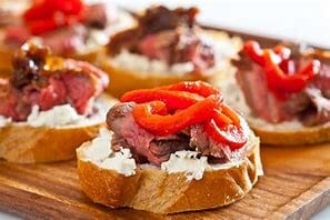 Grilled Flank Steak with Goat Cheese on Toast
