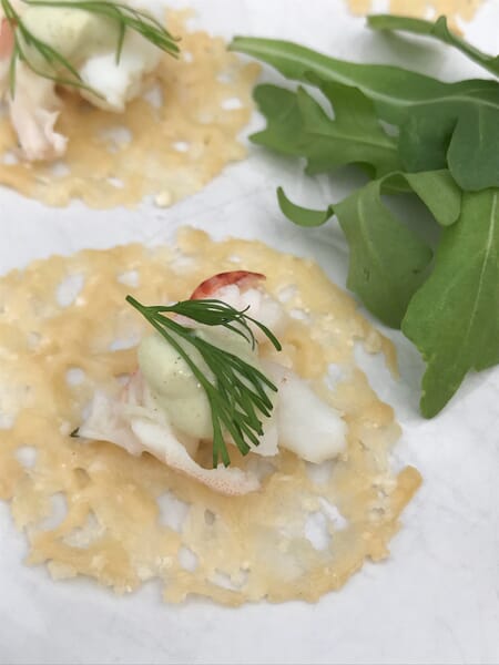 Poached Lobster With Wasabi Cream And Dill On Parmesan Crisp Rounds
